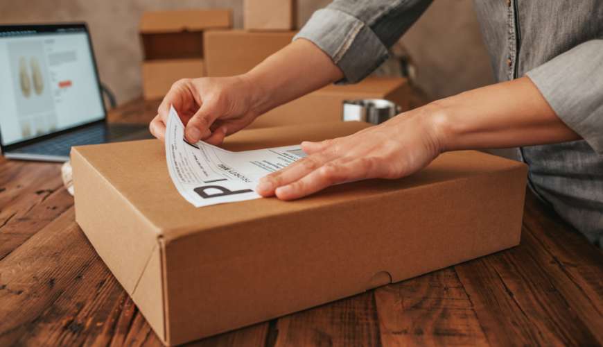 Box being labeled with direct thermal labels